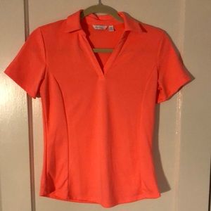 Bright coral Lady Hagen golf polo